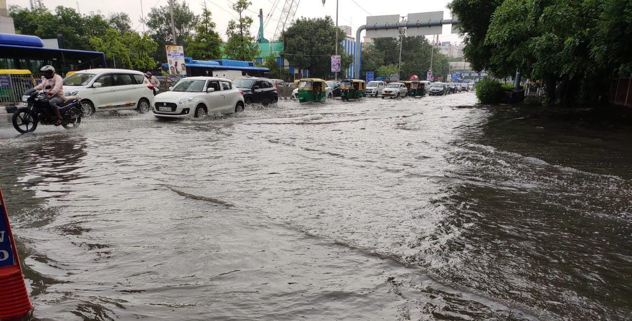 Delhi submerged in torrential rain waterlogging slowed down speed flights also affected