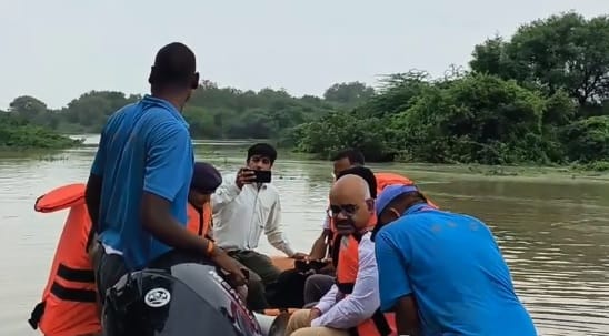 Kanpur DM visits flood-affected areas of Ghatampur inspects by boat communicating with villagers