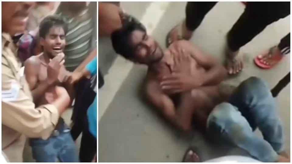 mob caught the suspect and beat him up after throwing him on the road