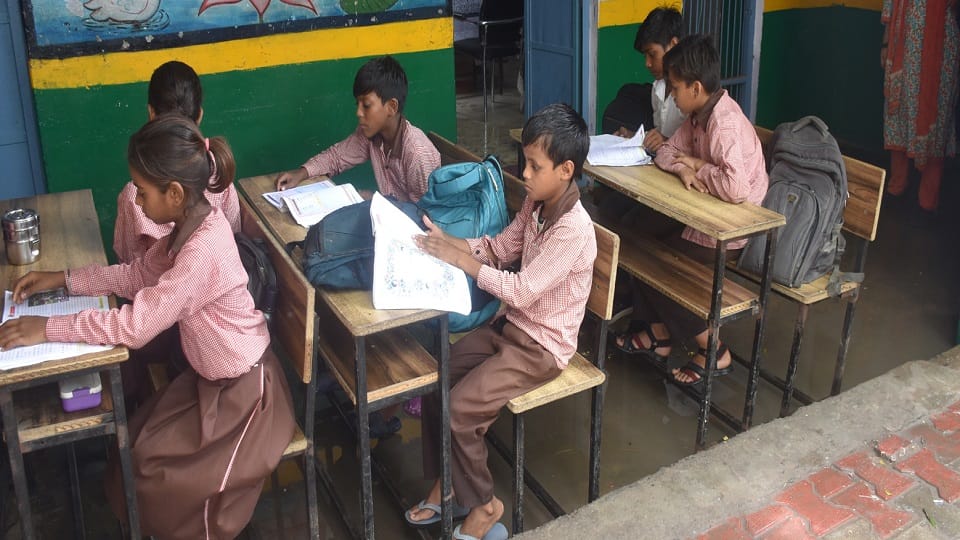 A school classroom is filled with water