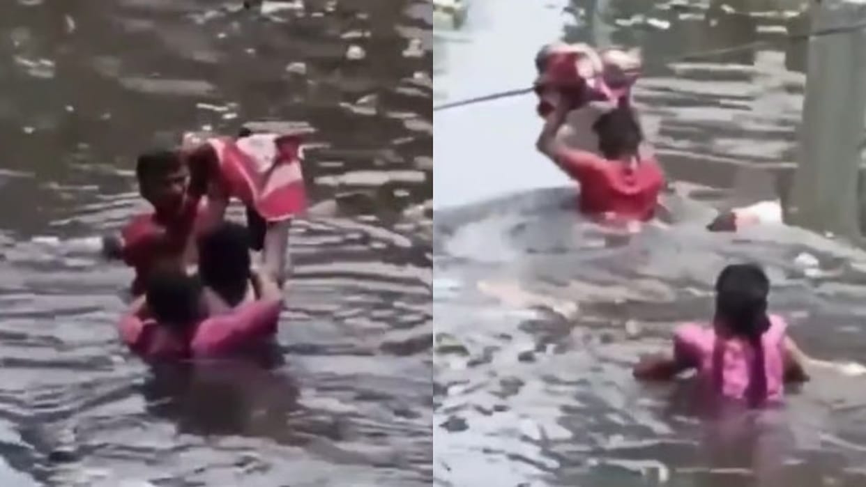 Man Rescuing His Woman And Child Like Bahubali In Prayagraj Of Up Heart Touching Video Goes Viral