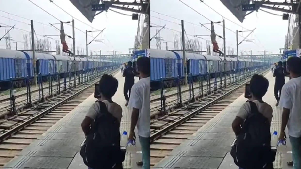 A young man was seen hanging on the overhead wire of the railway line Video goes Viral