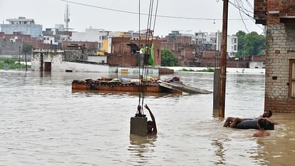 UP Flood News Temples Submerged Rajghat-Namo Ghat Route Closed as Ganga Water Level Rises see photos