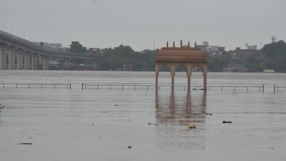UP Flood News Temples Submerged Rajghat-Namo Ghat Route Closed as Ganga Water Level Rises see photos