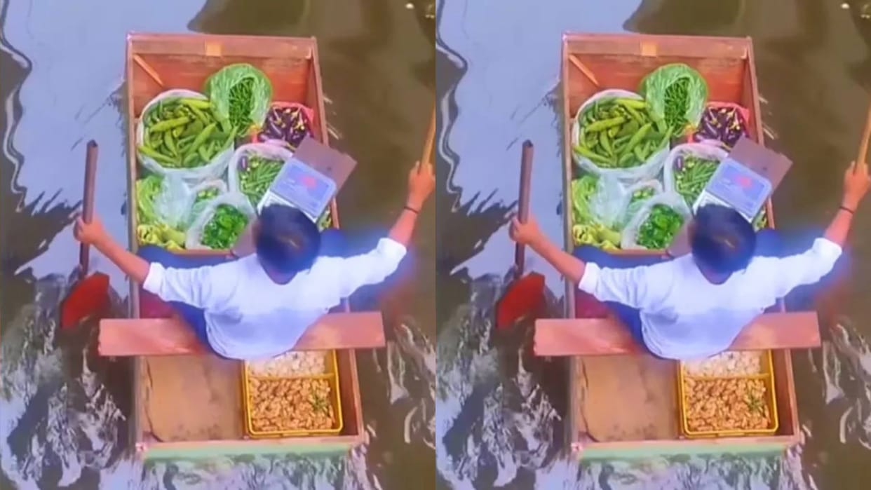 A man was seen selling vegetables in a boat amidst the flood in Prayagraj Video goes Viral on Internet