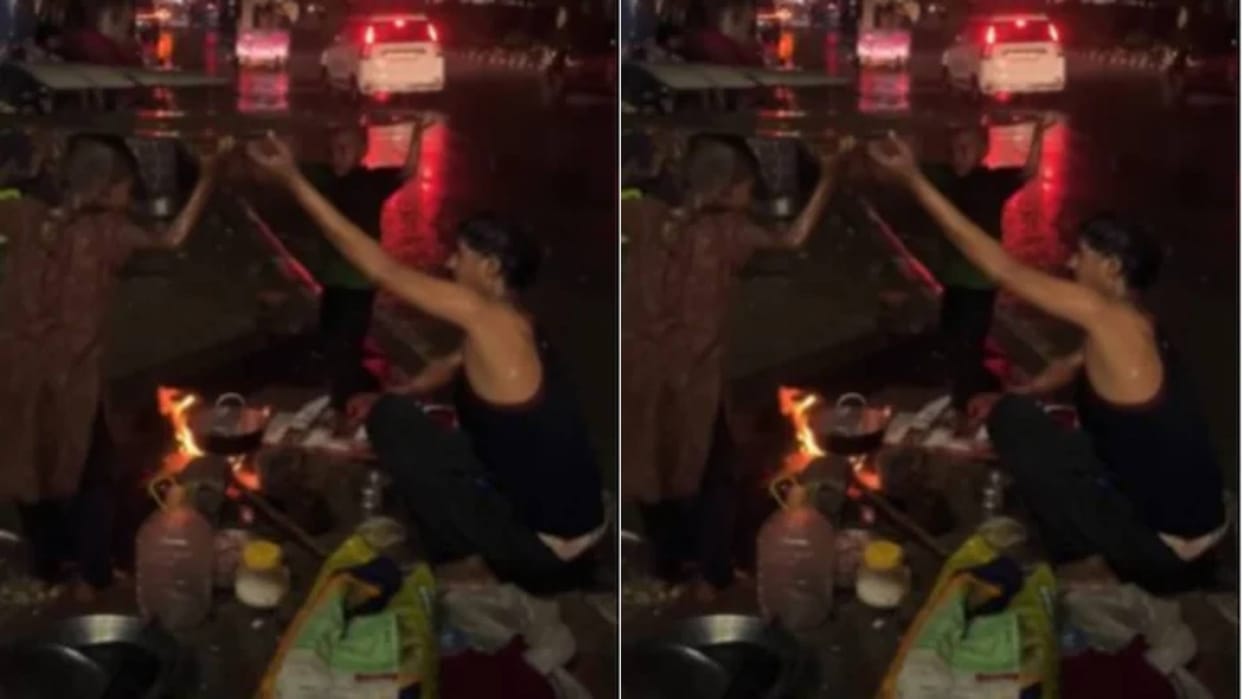 Father was cooking food in the rain to feed his family children were standing as shadow Video Viral
