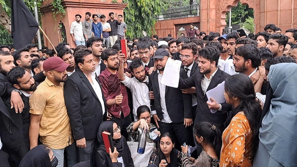 Demonstration was done by taking out a black coat march in AMU