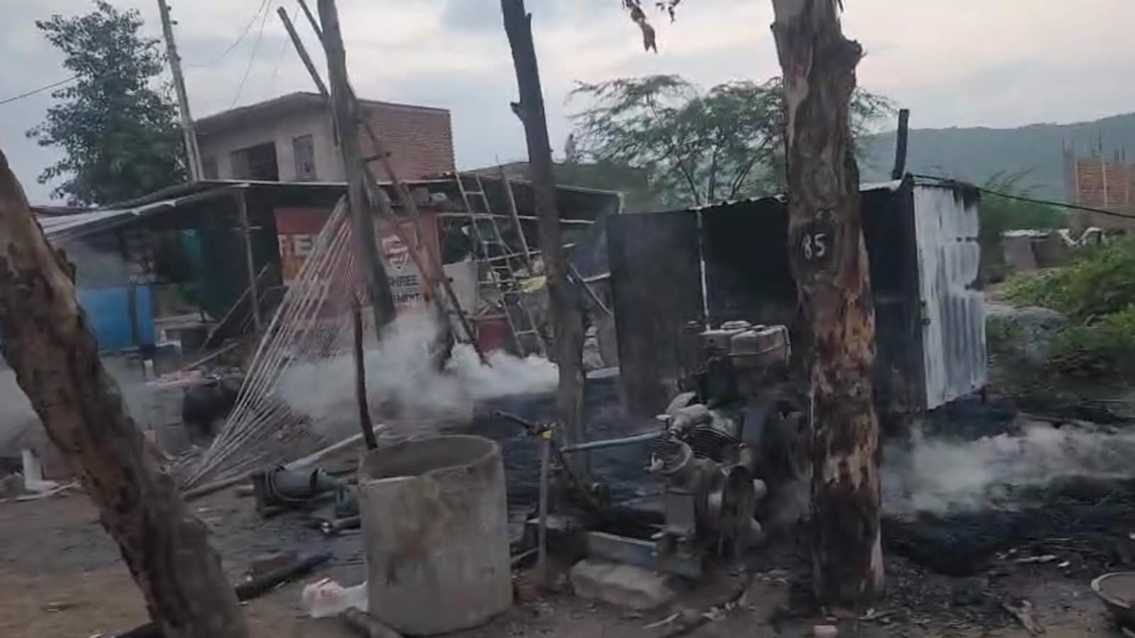 Nuh violence Fighting stone pelting and arson bikes and shops burnt bottles also thrown full story