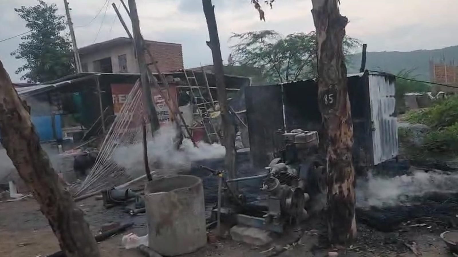 Nuh violence Fighting stone pelting and arson bikes and shops burnt bottles also thrown full story