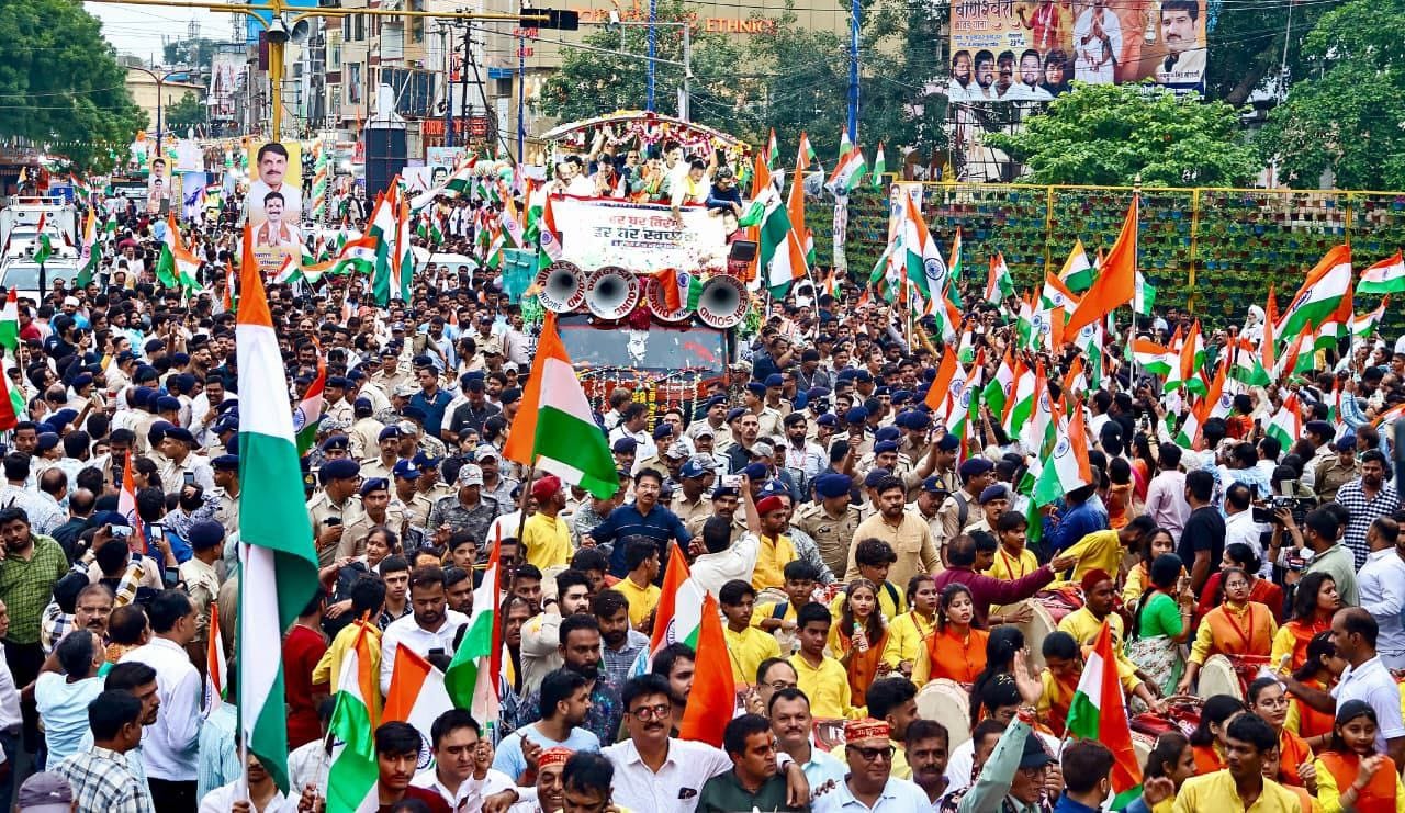 indore news cm mohan yadav drinks saffron milk visits temples waves tricolor in rally