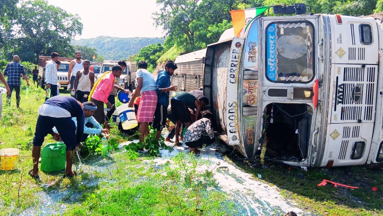 Tanker overturned people ran away with diesel in gallons buckets and pots sailor injured