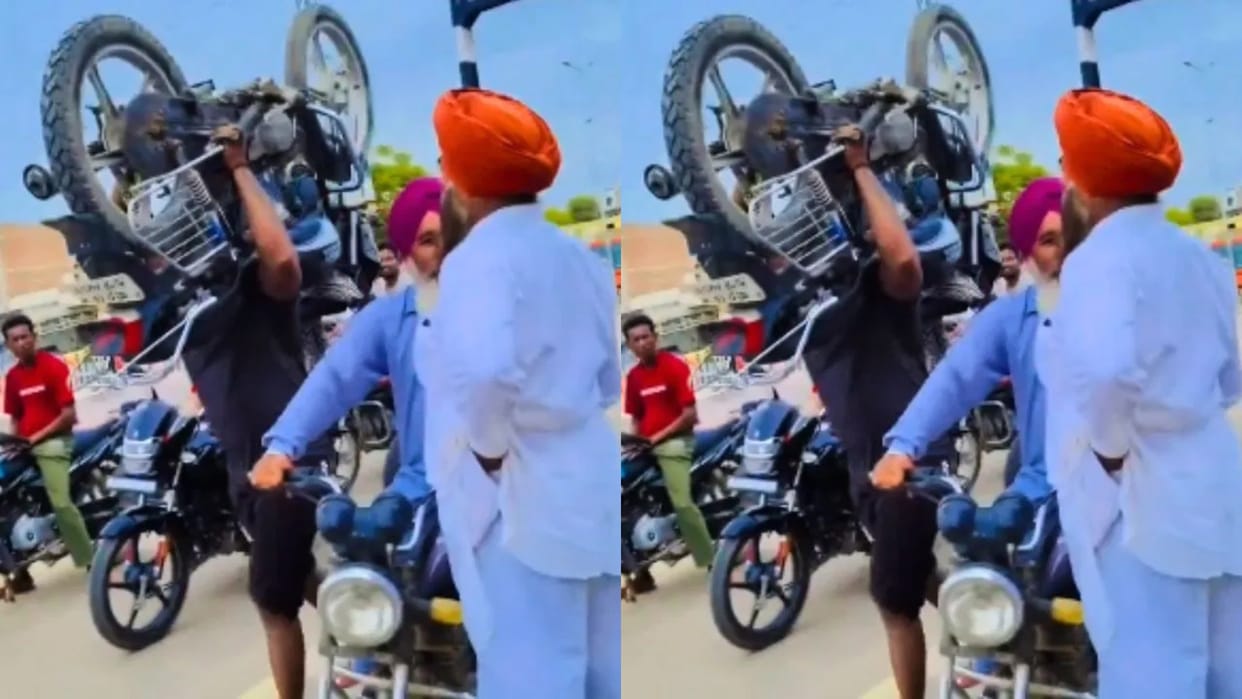 When the railway gate was closed the man crossed the crossing by carrying a 100 kg bike on his shoulder