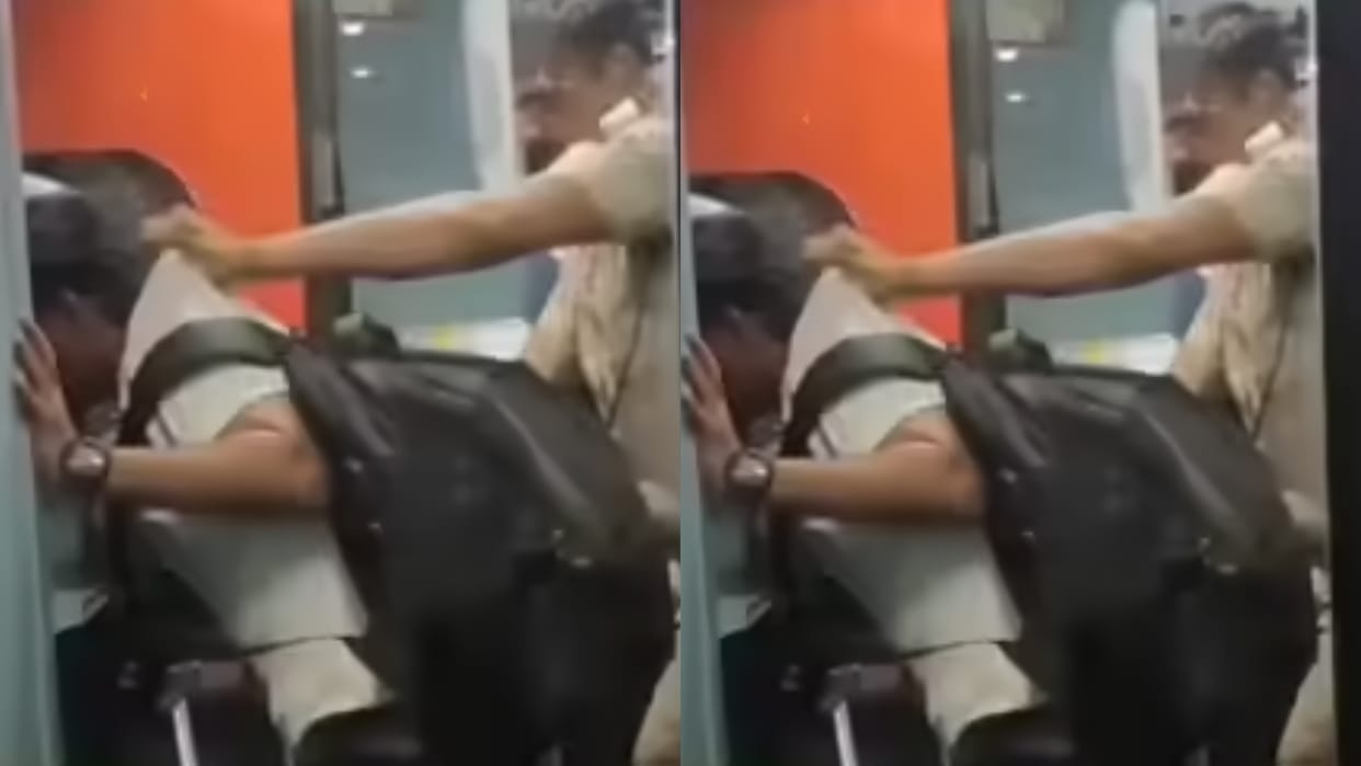 RPF officer tries to push a person travelling without ticket from a moving train Video goes Viral