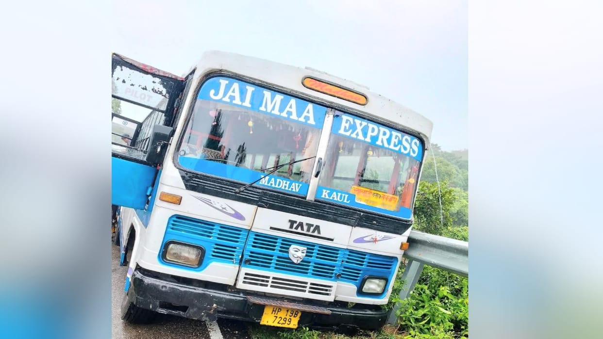 While passing a car, the bus tyre got stuck in the mud and it lost control and collided with the railing