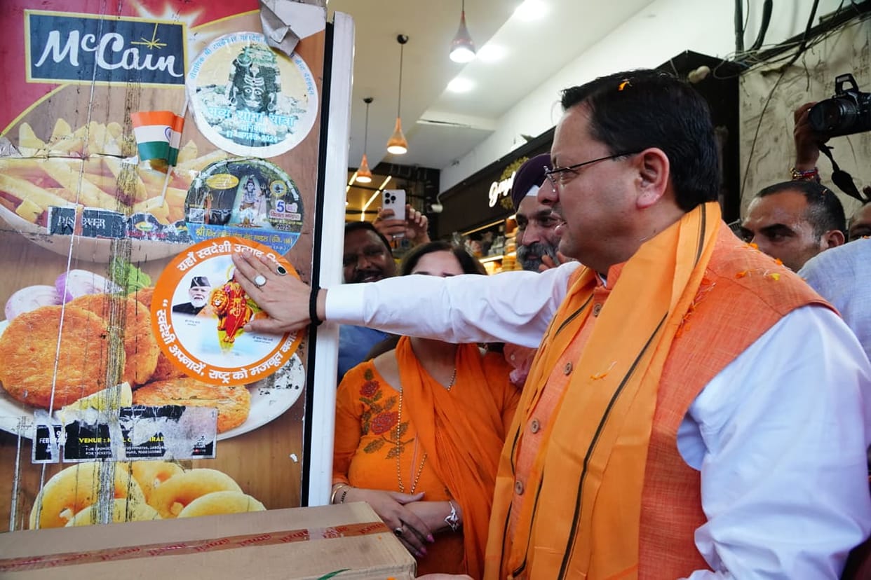 CM Dhami led the Adopt Swadeshi Take Nation Forward' campaign put stickers on shops in Paltan Bazar Dehradun