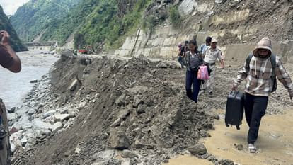 Himachal Flood Kullu Luggage on head and miles of walking flood turned roads into ruins