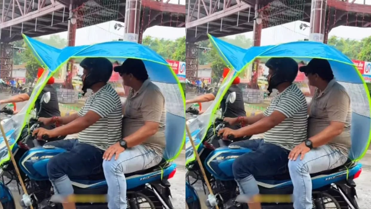 To save himself from rain, the boy did such Jugaad fitted the umbrella on the car Video goes Viral