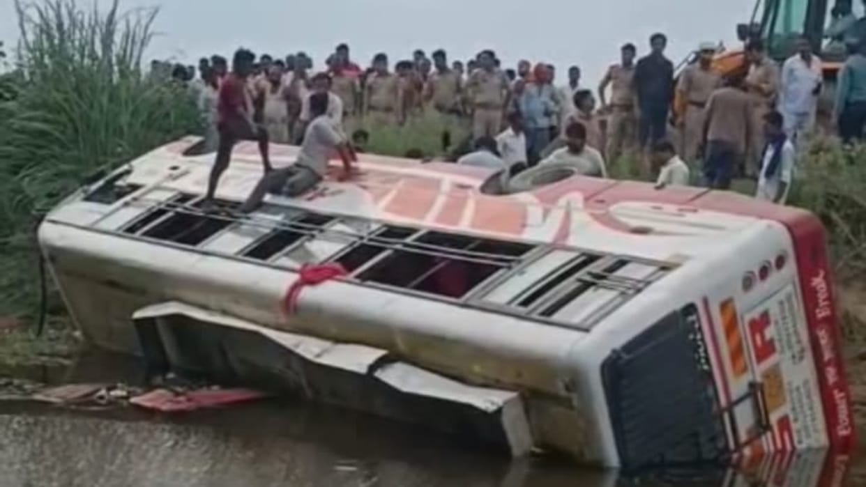 Private bus overturns in water filled ditch woman dies and 12 passengers injured in Budaun