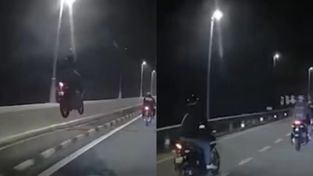 Biker was performing stunts while riding a bike when he jumped the bike on the divider Video Viral