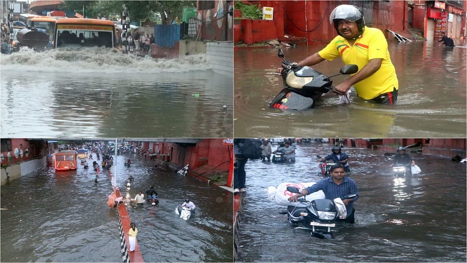 heavy rain Roads jammed houses and shops flooded child swept away in a drain dead body found 100 meters away