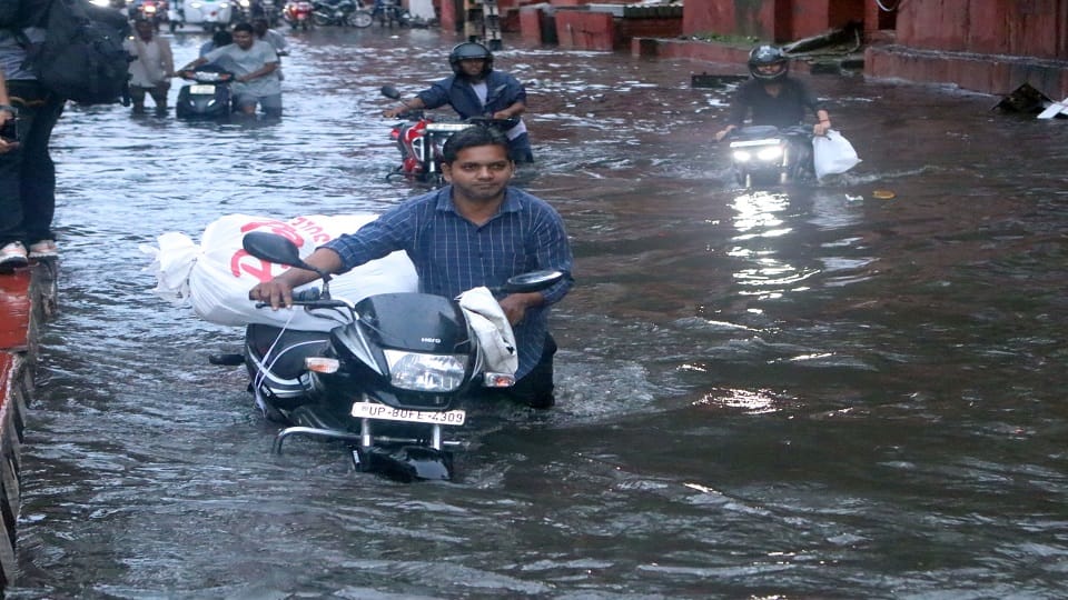 heavy rain Roads jammed houses and shops flooded child swept away in a drain dead body found 100 meters away