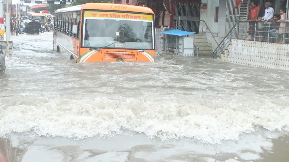 heavy rain Roads jammed houses and shops flooded child swept away in a drain dead body found 100 meters away