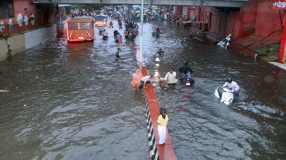 heavy rain Roads jammed houses and shops flooded child swept away in a drain dead body found 100 meters away