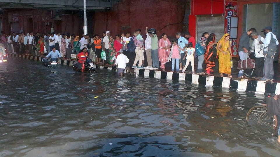 heavy rain Roads jammed houses and shops flooded child swept away in a drain dead body found 100 meters away