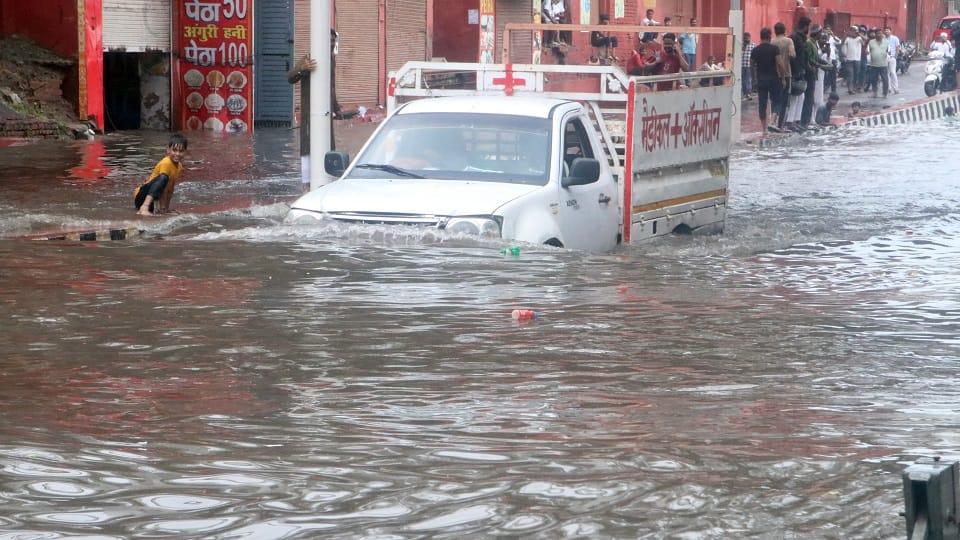 up weather agra rain flooded streets waterlogging traffic chaos Schools up to class 12th are closed