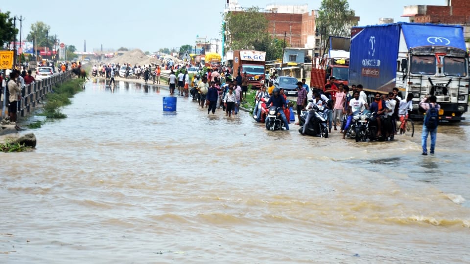 Shahjahanpur News Six PET exam centers shifted due to flood Two feet water on Delhi-Lucknow highway
