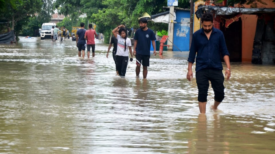 Shahjahanpur News Six PET exam centers shifted due to flood Two feet water on Delhi-Lucknow highway