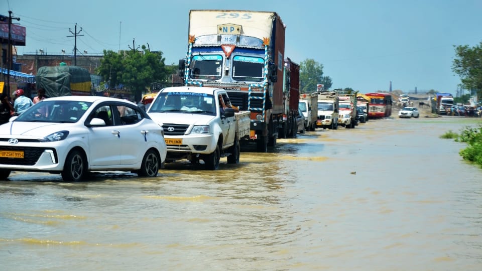 Shahjahanpur News Six PET exam centers shifted due to flood Two feet water on Delhi-Lucknow highway