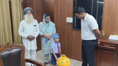 four and half year old child from Barnala gave his piggy bank to DC to help flood victims in Punjab
