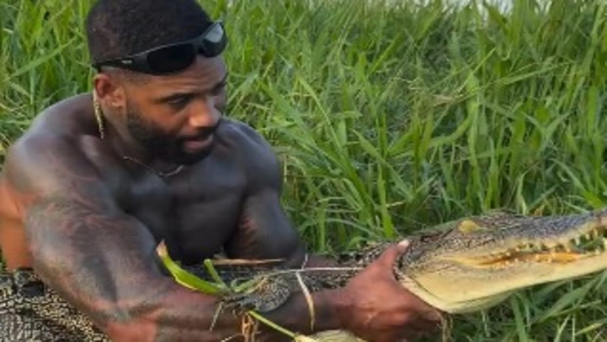 Viral video of daring person grab crocodile bare hands