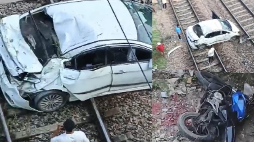 A bike and a car fell off a flyover onto the railway line below, near Mukarba Chowk