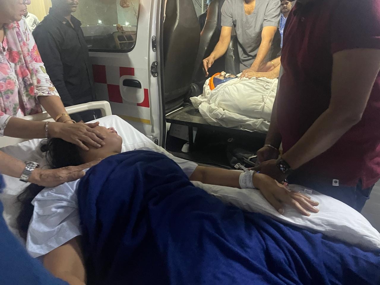 bmw accident Wife on stretcher husband dead body beside Son cried hugging his father before cremating