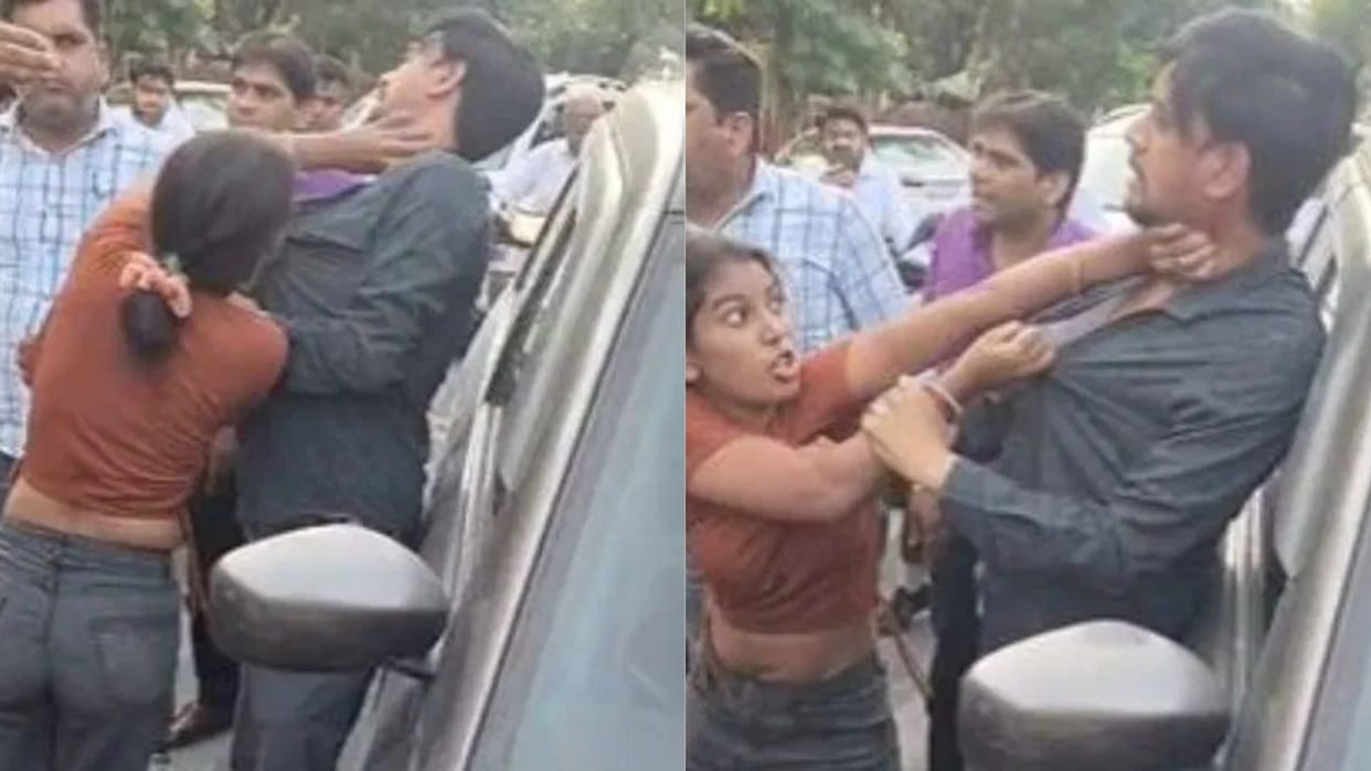 Wife beats husband by the collar on the road climbs on the bonnet of a moving car Video goes Viral