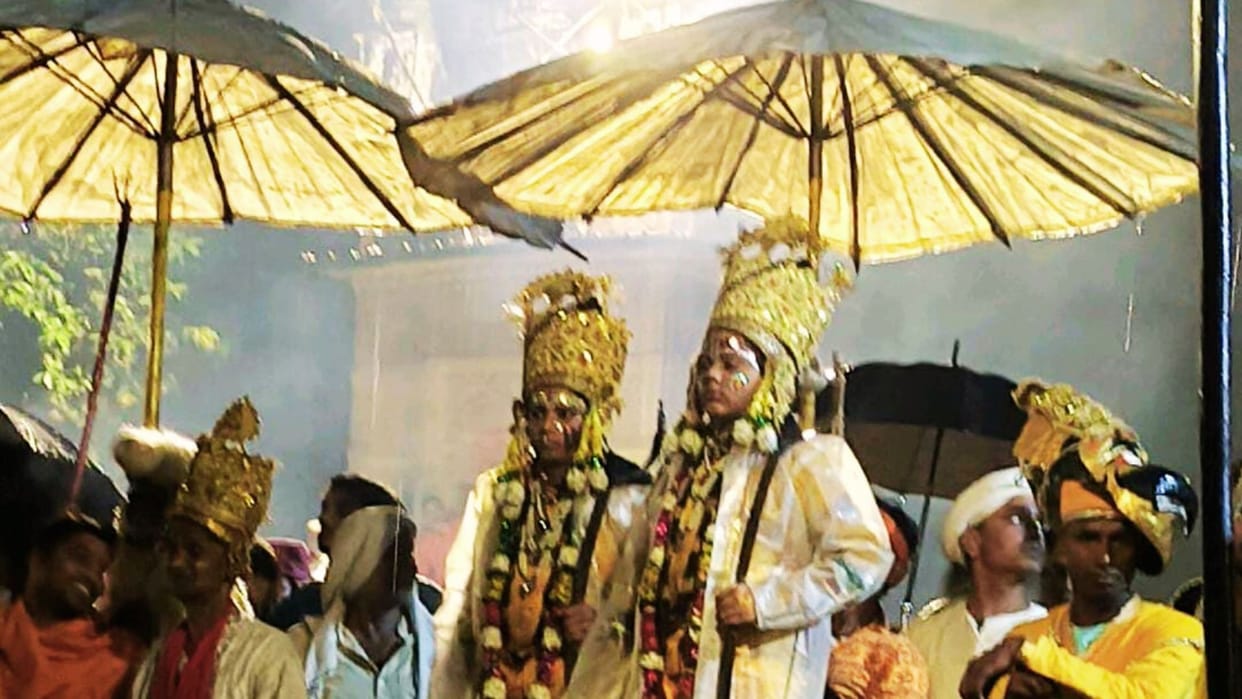 Ramnagar Ramlila Ram and Lakshman in raincoats under umbrellas devotees endured rain