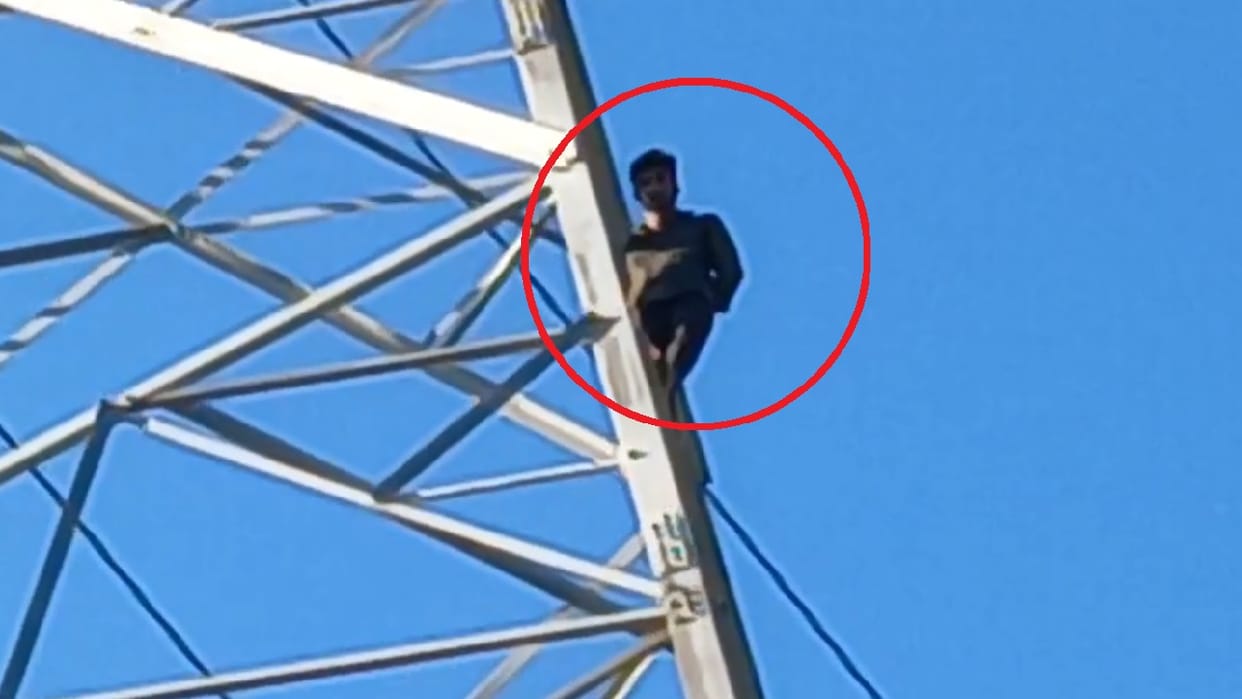 Young man climbed a high tension electric pole in Maharajganj