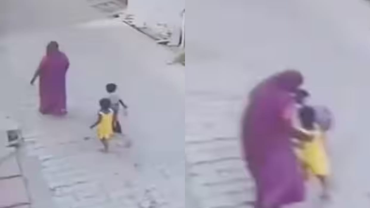 Boy falls into pothole while walking on road, mother pulls him out beats him slaps him Video goes Viral