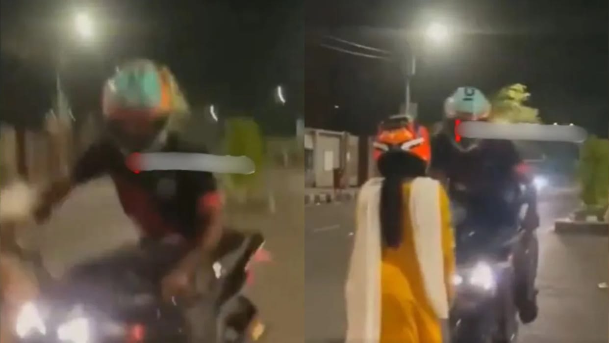 A boy was performing stunts in the middle of the road the bike overturned and fell on the girl Video Viral