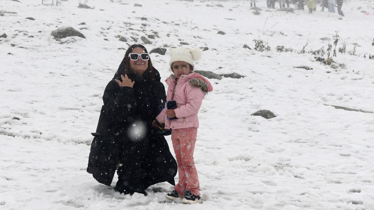 The first snowfall of the season at Kangdoori in Gulmarg brought smiles on the faces of tourists.