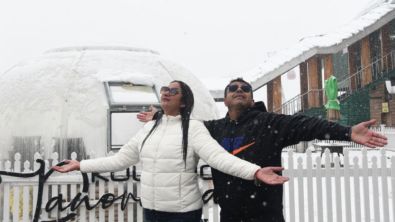 The first snowfall of the season at Kangdoori in Gulmarg brought smiles on the faces of tourists.