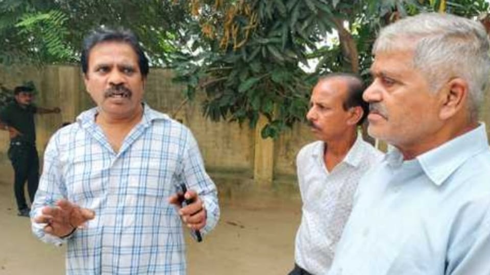 Man shot dead over dog burial dispute mother and son fell at his feet and pleaded