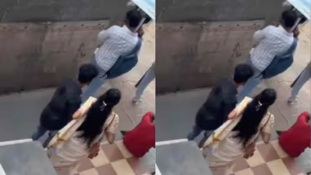 Husband busy on phone wife kisses another man behind his back video sparks debate on internet