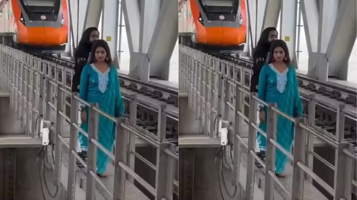 Couple filming a reel on the railway overbridge in front of Vande Bharat people got angry Video goes Viral
