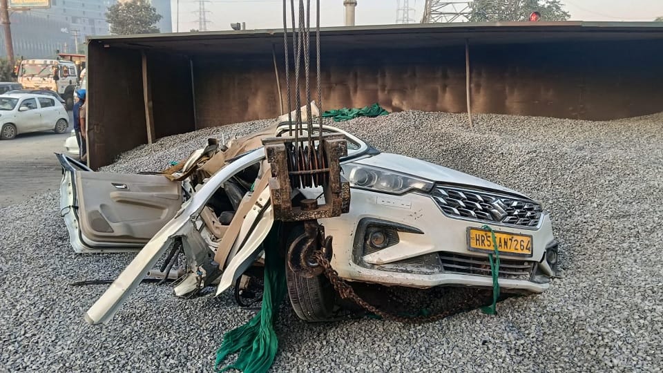 Several people injured as a truck overturns on a car in Gurugram