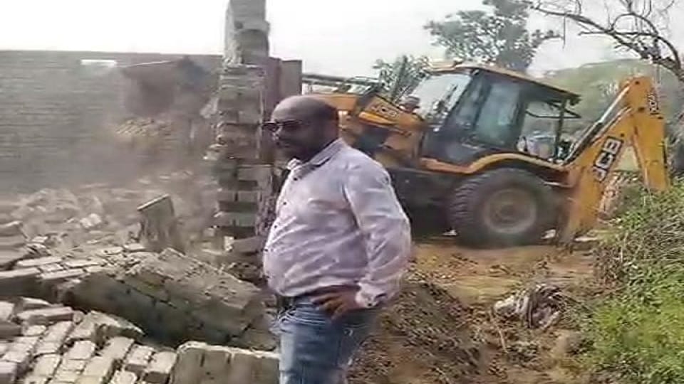 House built after occupying corporation land bulldozer runs in presence of tehsildar