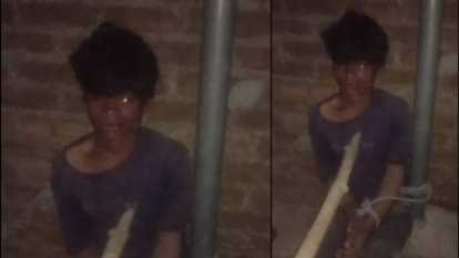 युवक को बांधे ग्रामीण