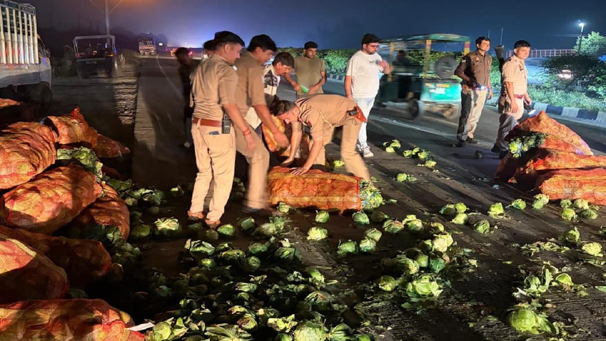 Pickup full of cabbage overturned on the highway in Hapur